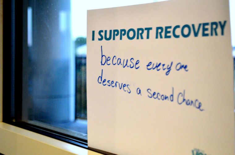 UNCW students filled out signs and posted them on the windows of the Clocktower Lounge for the Voices of Recovery event.