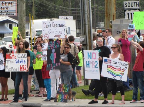 Members of the Wilmington community rally in opposition to House Bill 2, a new law in North Carolina, passed last week.