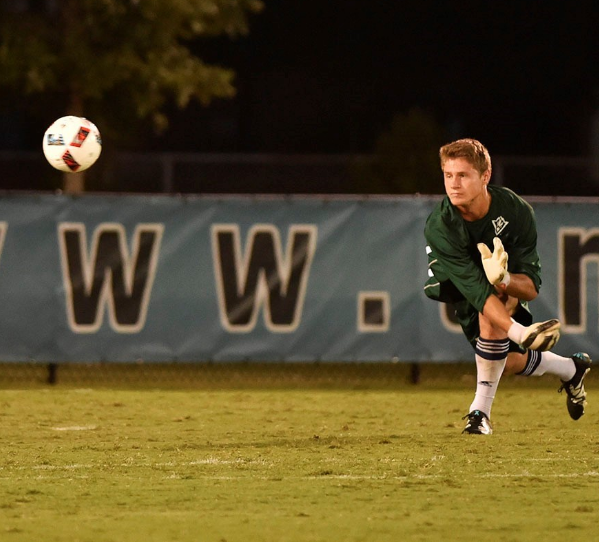 Ryan Cretens, above, hurls the ball away from UNCWs goal post during Fridays 3-0 win over Dayton.