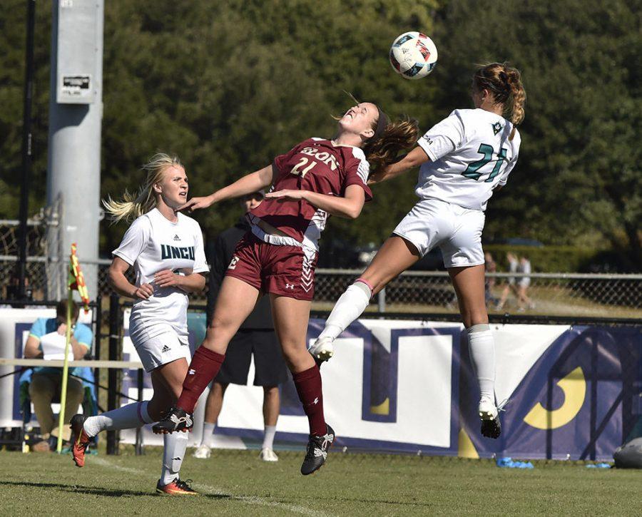 Ashley Johnson (21) goes up for a ball as Elon attacker Rachel Hallman attempted to advance downfield in Sundays game.