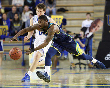 Ambrose Mosley grabs for a ball in UNCWs away game at Drexel on Jan. 5. The Seahawks secured a regular-season sweep of the Dragons in a 87-74 home win on Saturday.