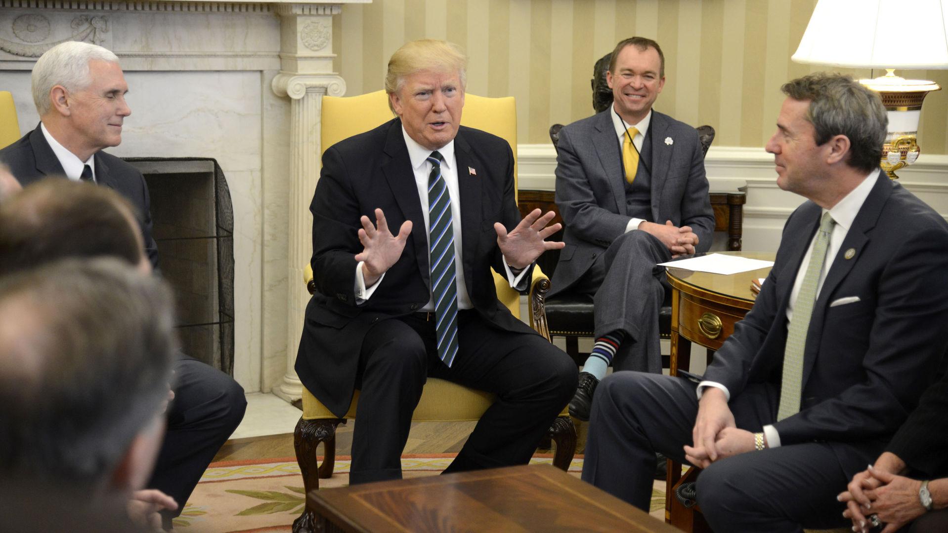 President Donald Trump (C) makes remarks as Vice President Mike Pence (L) listens as they meet with the Republican Study Committee in the Oval Office of the White House on March 17, 2017 in Washington, DC. (Mike Theiler/UPI/Abaca Press/TNS)