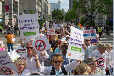 Demonstrators call for the repeal of HB2 in Raleigh, N.C., on April 25, 2016. The state marks the first anniversary the bill, widely criticized as anti-LGBT, which has cost North Carolinians jobs, money, performances and events, including this montha s NCAA basketball tournament. (Jill Knight/Raleigh News & Observer/TNS)