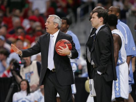(April 2) ST. LOUIS, MO - North Carolina head coach Roy Williams, left and assistant coach C.B. McGrath watch as referees break up an altercation between Michigan State and North Carolina during the first half in the semifinal game of the Men's NCAA Final Four basketball tournament in St. Louis, Missouri, Saturday, April 2, 2005. (lde) 2005