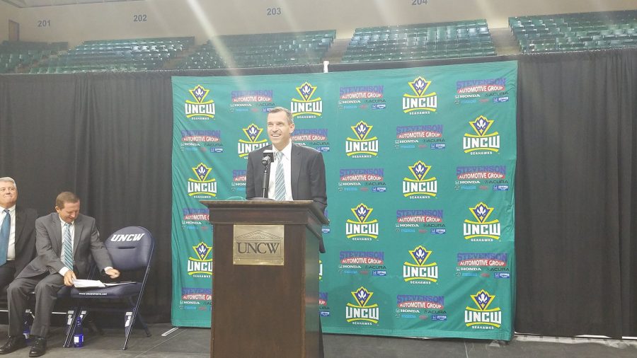 C.B.+McGrath+greets+UNCW+fans+with+a+smile+during+the+opening+press+conference+welcoming+him+as+the+next+UNCW+head+coach.