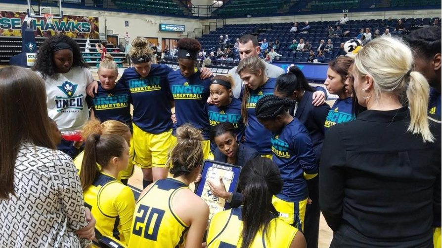 Adell Harris, center, talks to her team before tipoff vs. College of Charleston this past season.