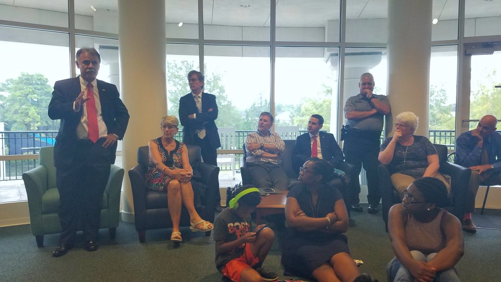 UNCW Chancellor Jose V. Sartarelli, left, addresses those gathered in the Clocktower Lounge during Thursdays discussion regarding recent events in Charlottesville, Va.