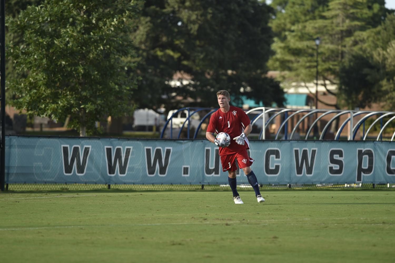 Goalkeeper Ryan Cretens fields the ball in a game during the 2016 UNCW mens soccer season.