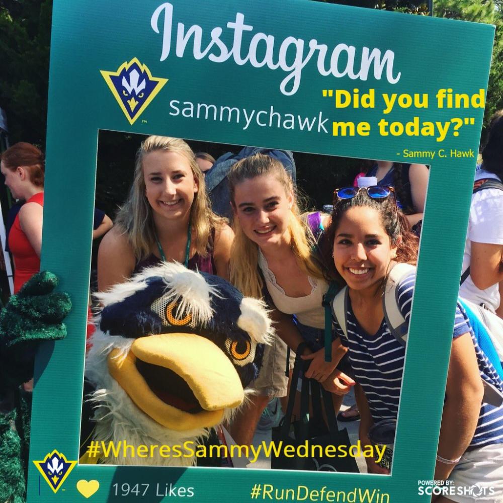 Sammy C. Hawk, left, snaps a selfie with students during Wednesday's involvement carnival just hours after losing to North Texas mascot Scrappy in the Mid-Major Madness Mascot Melee. (Source: Twitter)