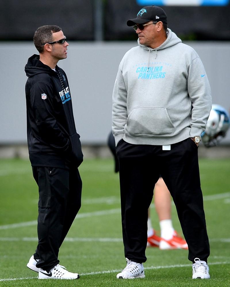 Carolina Panthers assistant general manager Brandon Beane, left, and head coach Ron Rivera talk during the second session of the teams rookie minicamp in Charlotte, N.C., on Friday, May 5, 2017. (Jeff Siner/Charlotte Observer/Tribune News Service)