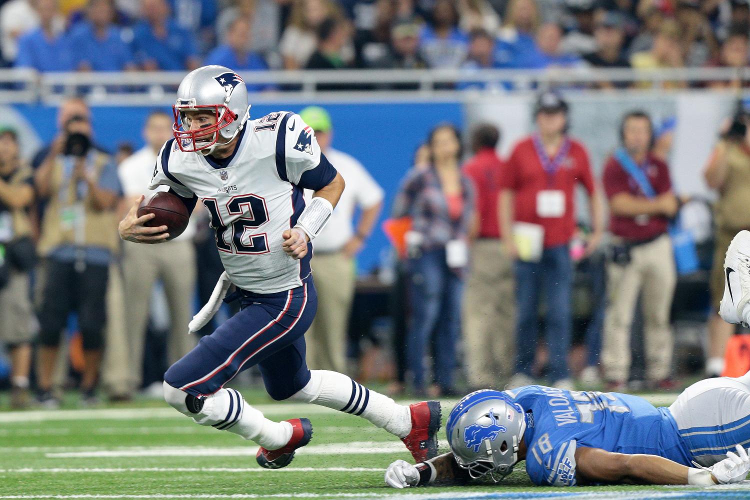 New England Patriots quarterback Tom Brady (12) runs the ball during the first half of an NFL football game against the Detroit Lions in Detroit, Michigan USA, on Friday, August 25, 2017.
