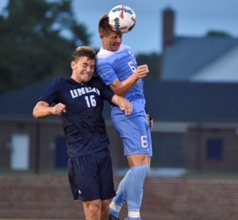 Emil Elveroth, left, heads up for a ball during UNCW's 1-0 win over No. 3 North Carolina on Sept. 1, 2017.