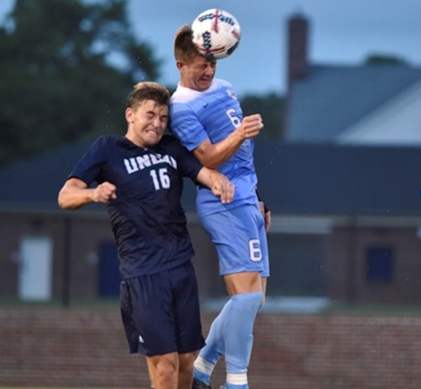 Emil Elveroth, left, heads up for a ball during UNCWs 1-0 win over No. 3 North Carolina on Sept. 1, 2017.