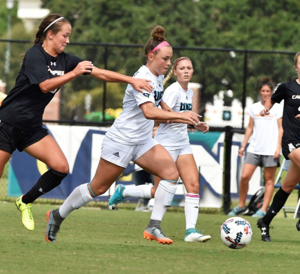 Serenity Waters, middle, goes on the attack during UNCWs 2-1 win over Campbell on Sunday, Sept. 17, 2017.
