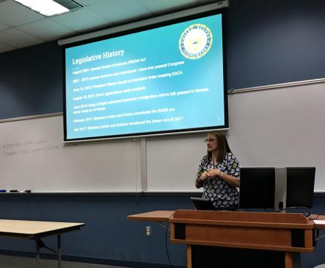 Dr. Amanda Boomershine speaking with students, faculty, staff and visitors about the regulations and issues surrounding DACA.