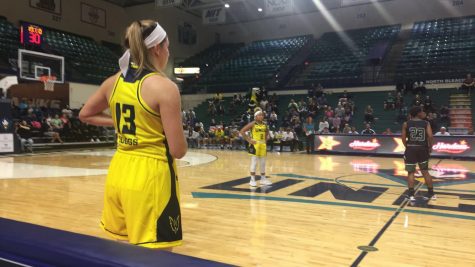 Lacey Suggs (left) prepares to take ball in prior to the second half start.