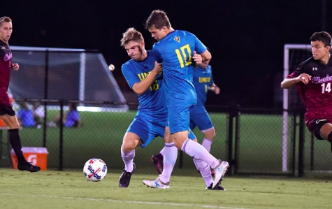 UNCW's Emil Elveroth (16) and Phillip Goodrum (10) get tangled up with one another during the Seahawks' 2-1 loss to College of Charleston on Wednesday, Oct. 11.