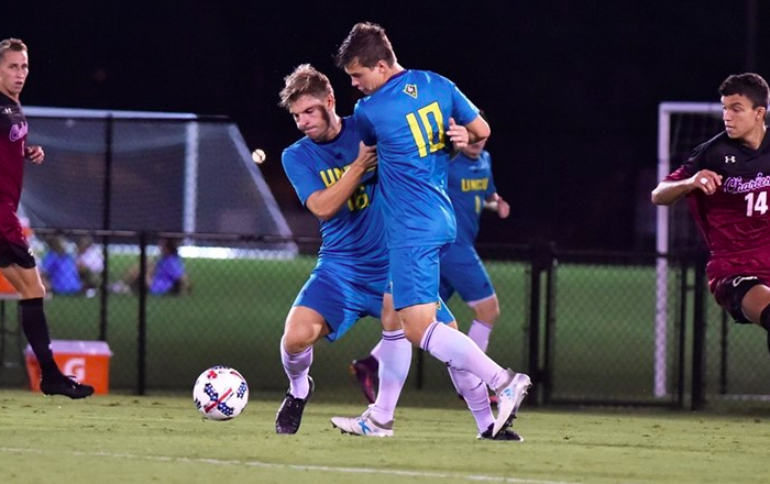 UNCWs Emil Elveroth (16) and Phillip Goodrum (10) get tangled up with one another during the Seahawks 2-1 loss to College of Charleston on Wednesday, Oct. 11.