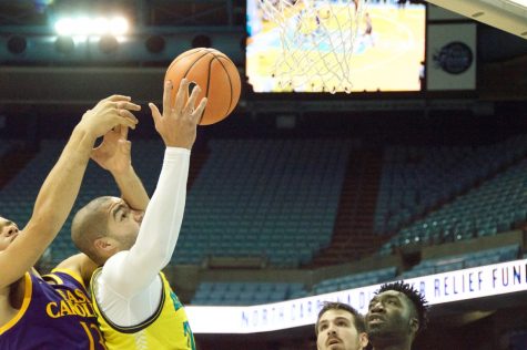 UNC Wilmington's Marcus Bryan tries for a layup in UNCW's scrimmage vs. East Carolina on Sunday, Nov. 5, 2017.