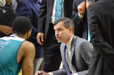 Head coach C.B. McGrath in the huddle