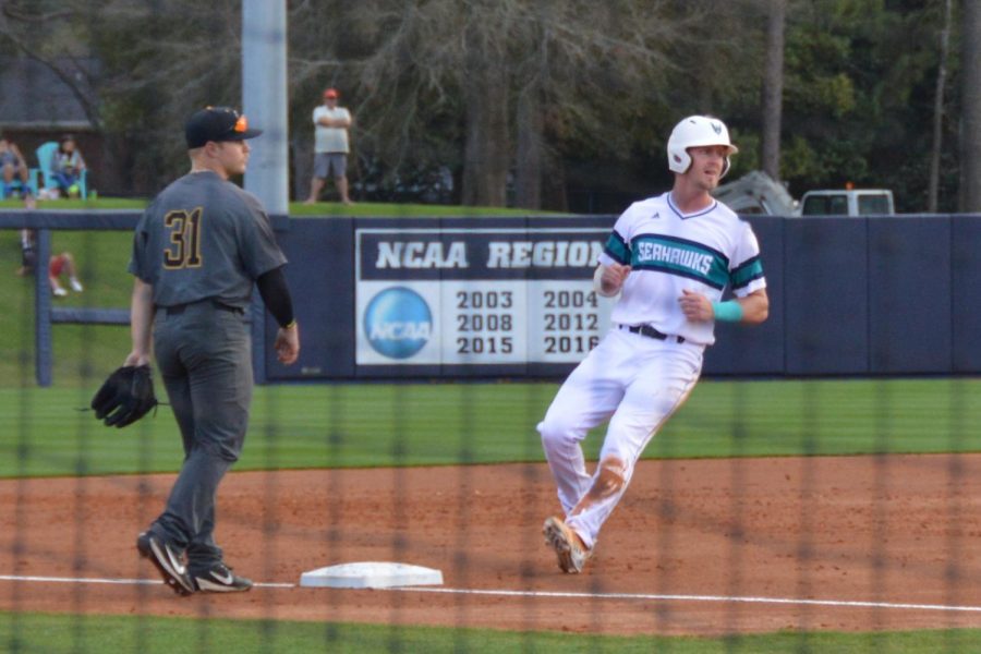 No. 36 Kep Brown steals third base following a wild pitch on Friday, Feb. 23.