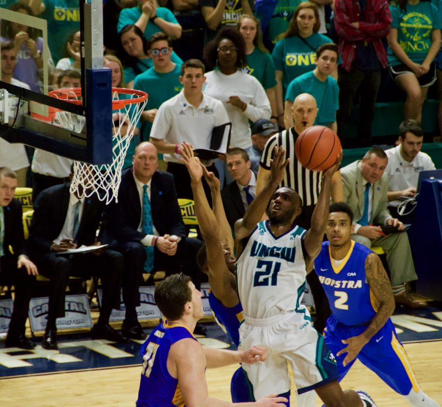 No. 21 Ty Taylor attempts a layup