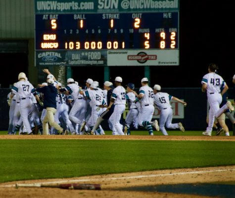 The Seahawks celebrate following their 5-4 walk-off victory over Eastern Kentucky on Friday