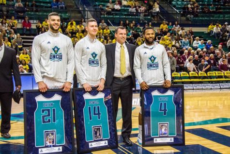 Coach McGrath stands proudly with his senior players Marcus Bryan, Nick Powell and Jordon Talley