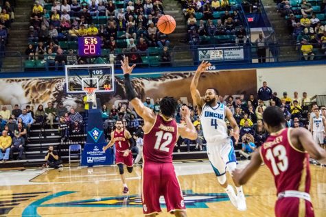 Jordon Talley gracefully lobs an ally-oop look to a cuuting Devontae Cacok