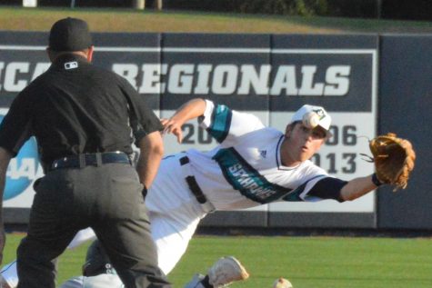 Second baseman No. 7 Jackson Meadows attempts to make a diving catch