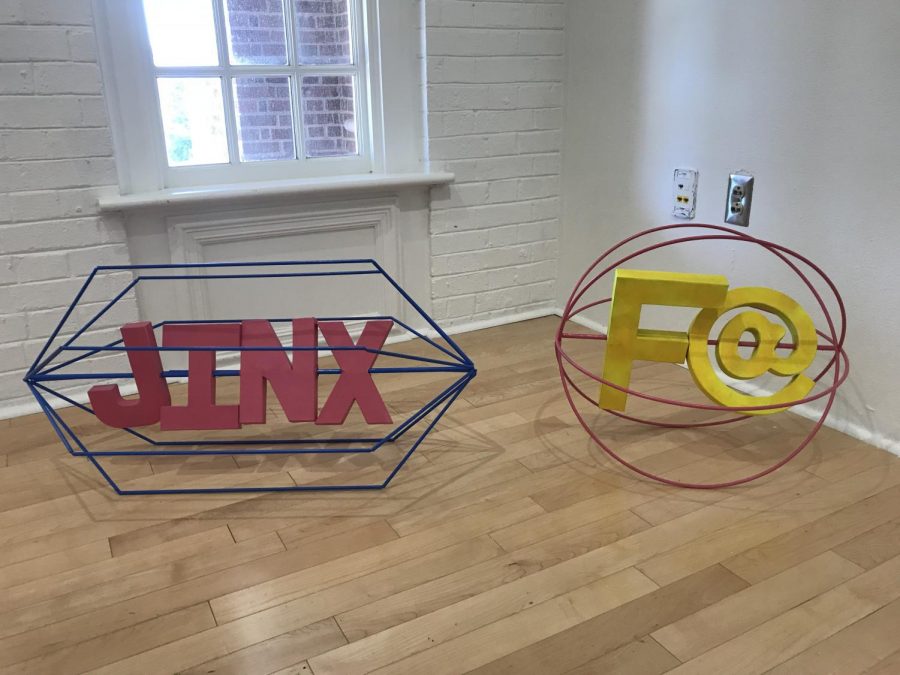 UNCW student Jonny Harris created his two sculptures, Pick Me Up JINX and Please Touch F@, out of steel, cardboard and spray paint.