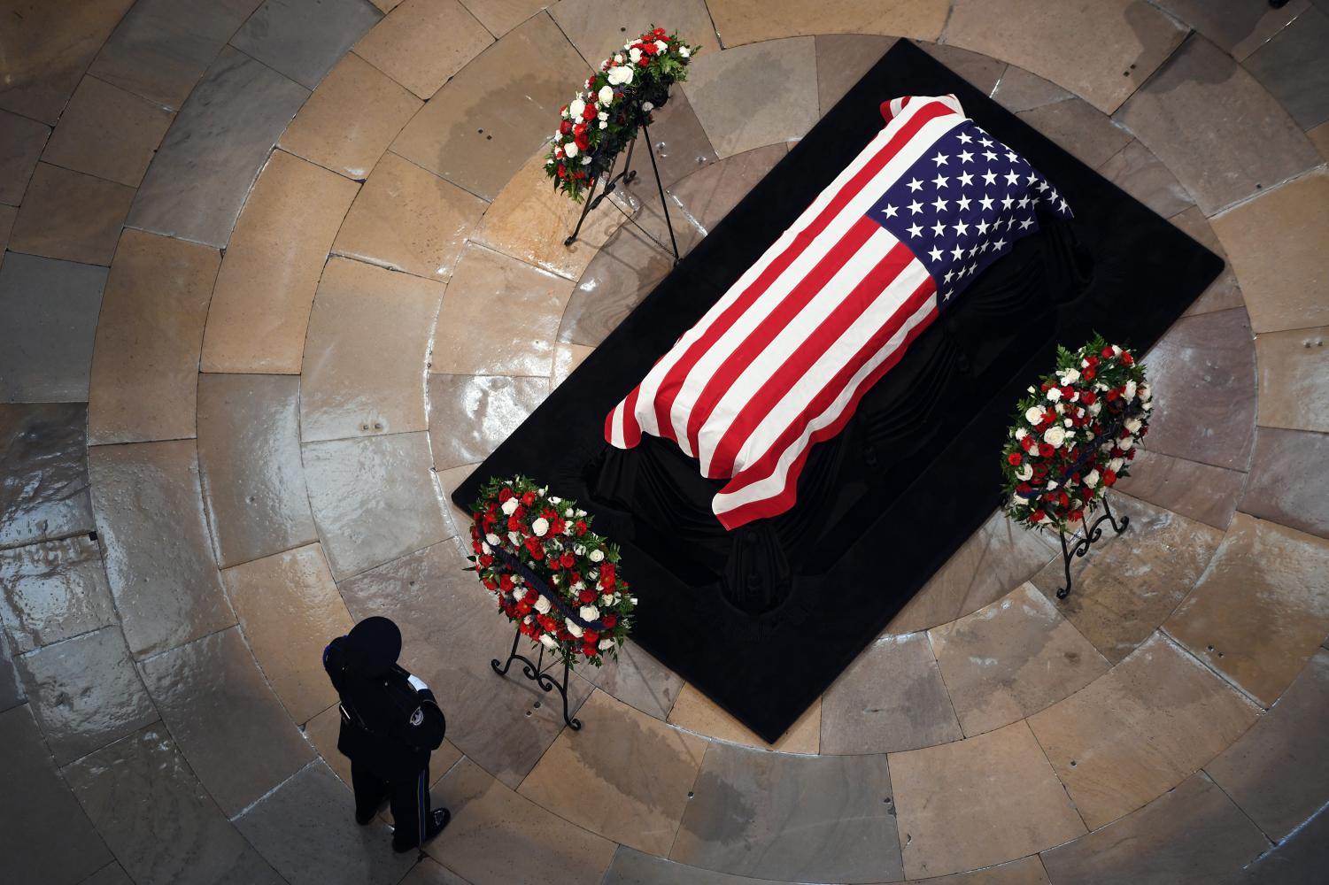 An individual pays respect near the casket of the late U.S. Sen. John McCain at the U.S. Capitol Rotunda on Aug. 31, 2018
Photo courtesy of: (Olivier Douliery/Abaca Press/TNS)