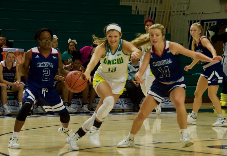 Lacey Suggs (13) attempts to recover a loose ball