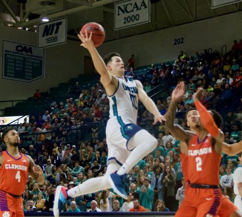 Kai Toews (10) flies in for the easy layup