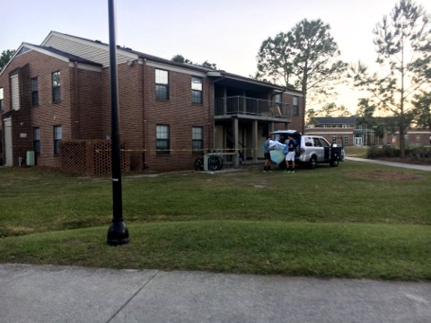 Prior residents of the University Apartments, which have been closed indefinitely due to Florence, are seen packing any last posessions.