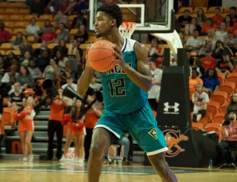 Jay Estime' (12) during UNCW's season opener against Campbell.