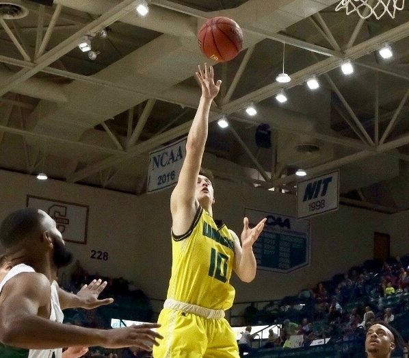 Kai Toews (10) throws up a floater during UNCW's exhibition against William Peace