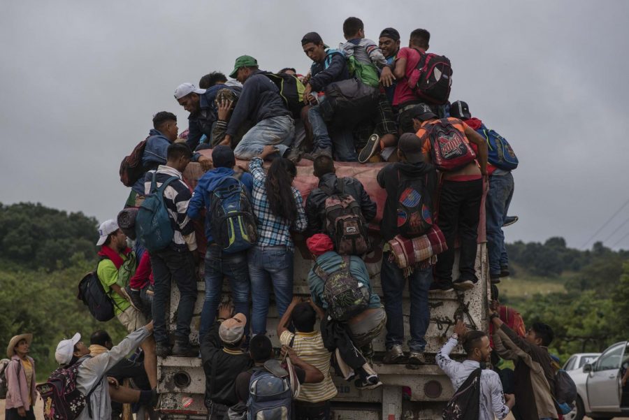 Migrants jump on a truck in order not to have to walk a part of their long way on Nov. 3, 2018 in Sayula, Veracruz, Mexico. Most of the migrants come from Honduras. They are currently on their way through Mexico towards the U.S. border. 