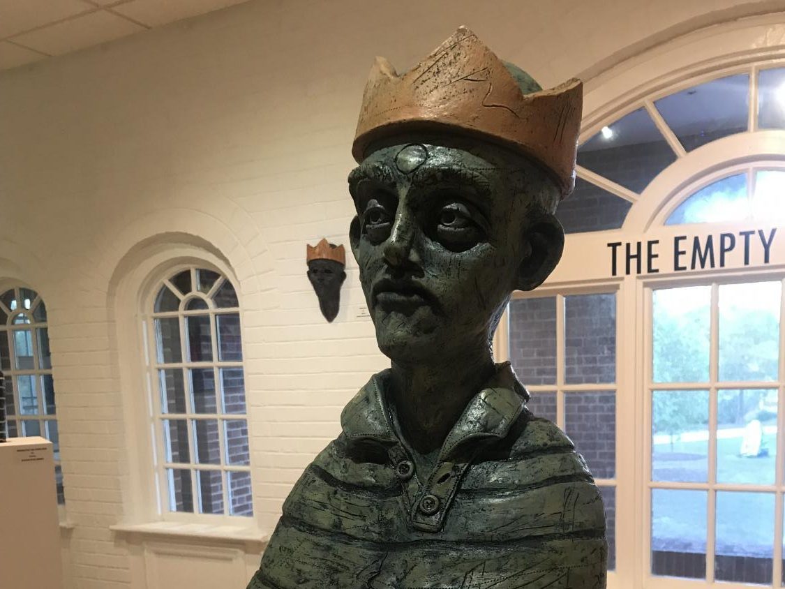 “Blind Greed” is the main centerpiece of artist Nathan Ryan Verwey’s collection in the Boseman Gallery lasting until Nov. 9. This piece is sculpted of ceramic and is on sale for $1000. - Photo by Brenna Flanagan