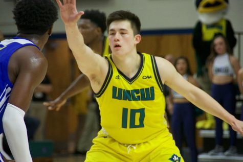 Kai Toews (10) locks down on defense during UNCW's home matchup with Delaware on Jan. 10, 2019.