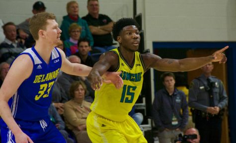Devontae Cacok (15) calls for a pass during UNCW's home matchup with Delaware on Jan. 10, 2019.