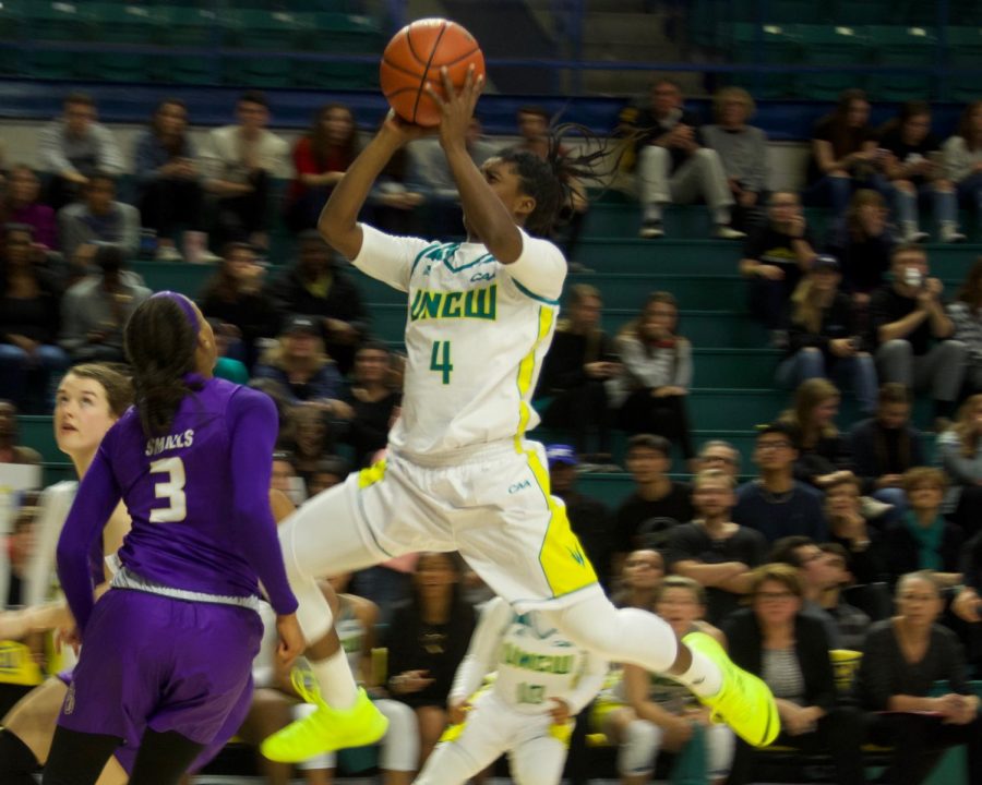 Shrita Parker (4) hits a floater during UNCWs matchup with James Madison on Jan. 18, 2019.