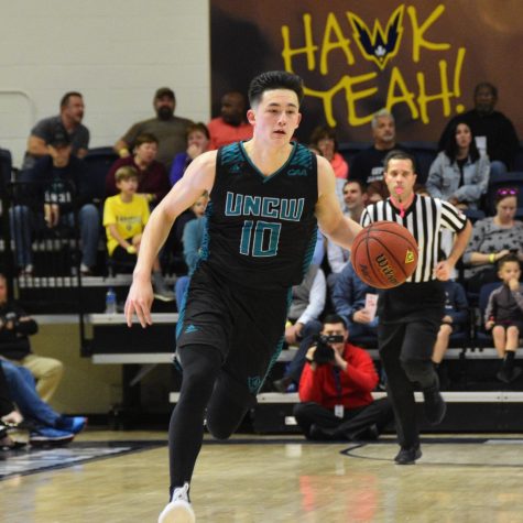 Kai Toews (10) drives up the court during UNCW's Thursday night matchup with William & Mary on Jan. 24, 2019.