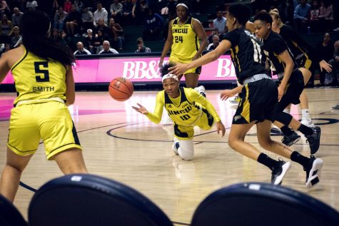 Ashyiona Vason (10) manages to get a tough pass away after stumbling