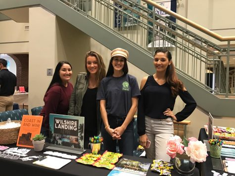 Representatives stand for photo at PERCH housing fair.