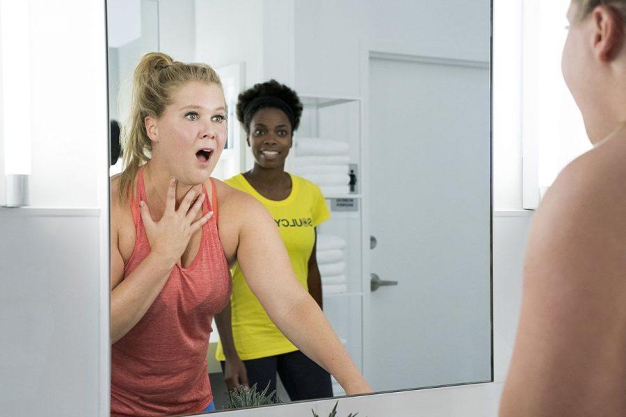 Amy Schumer admiring herself in the the controversial 2018 film I Feel Pretty.