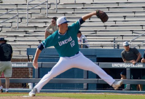 Luke Gesell (12) pitches during UNCW's season opener against St. Joseph on Feb. 15, 2019 at Brooks Field.