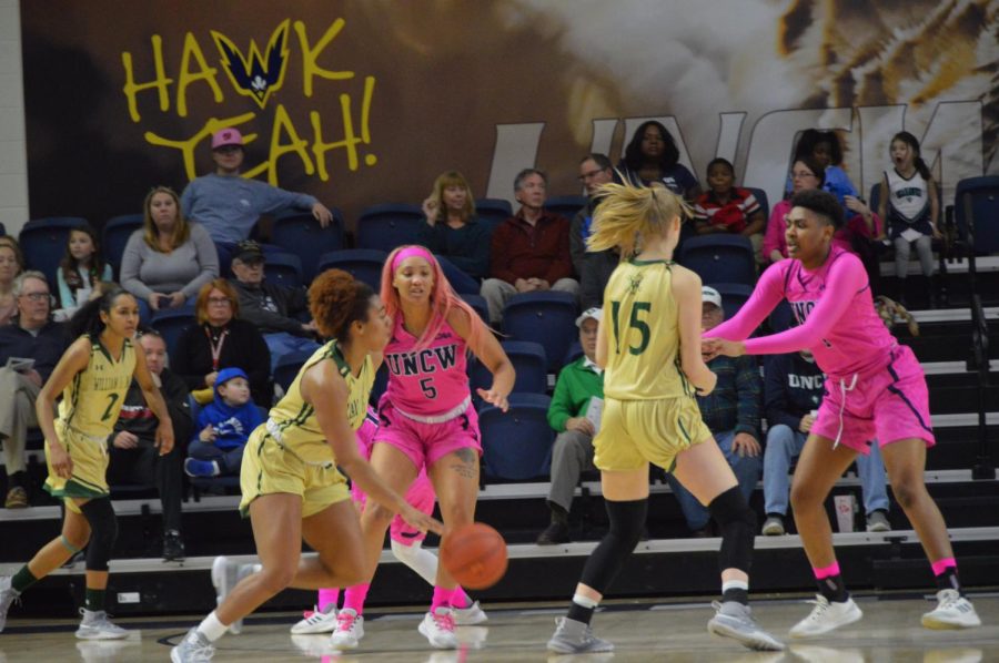 GiGi Smith (5) and Paige Powell (1) on defense in win over William & Mary on Feb. 10 inside Trask Coliseum.