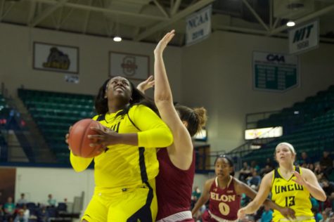 Chinyere Bell (24) fights for a layup against Elon on Feb. 8, 2019.