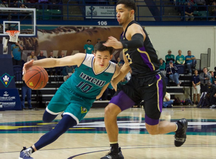 Kai Toews (10) attempts to break past a defender during UNCWs Homecoming matchup against James Madison on Feb. 2, 2019.